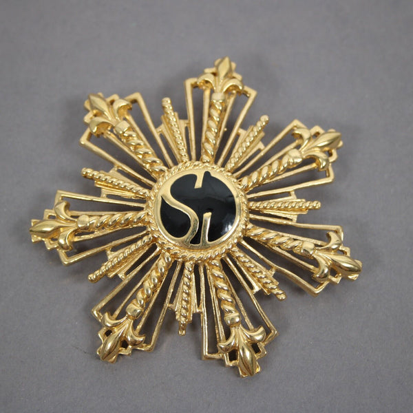 St John Black Enamel Goldtone Filigree Starburst Logo 2.5" Pin