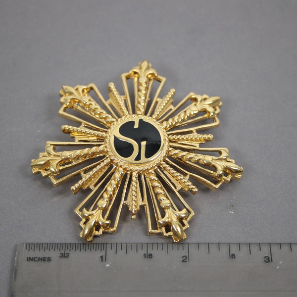 St John Black Enamel Goldtone Filigree Starburst Logo 2.5" Pin